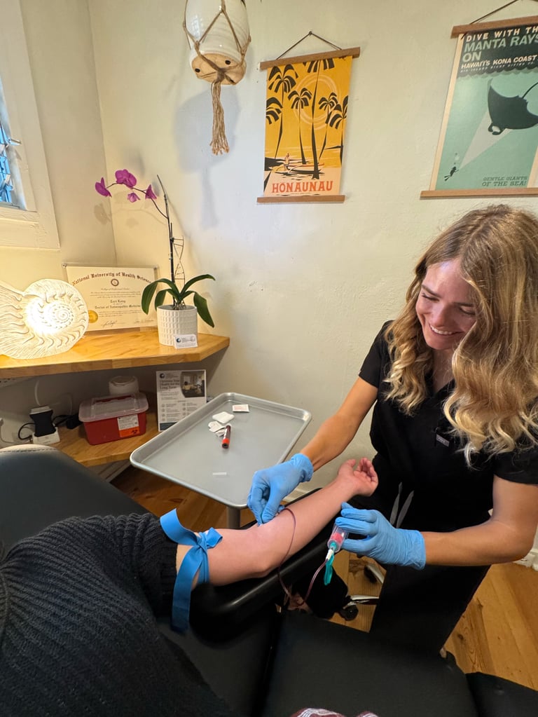 Healthcare worker in blue gloves drawing blood from patients arm in medical office with decorative plants and wall art