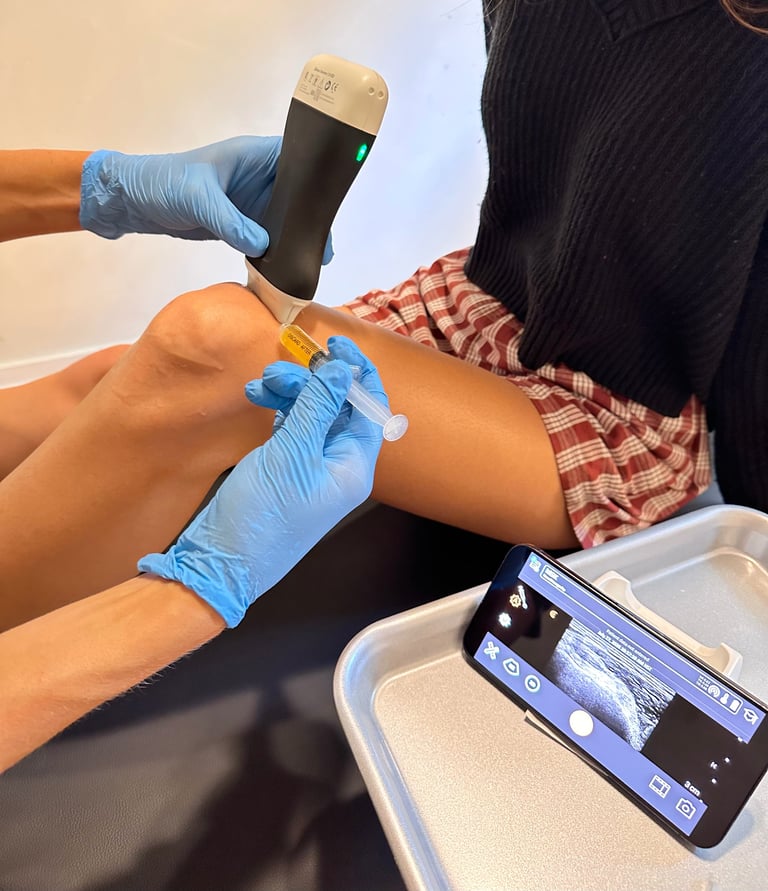 Healthcare provider using ultrasound device on patients leg at Hawaii Longevity and Regenerative Medicine clinic